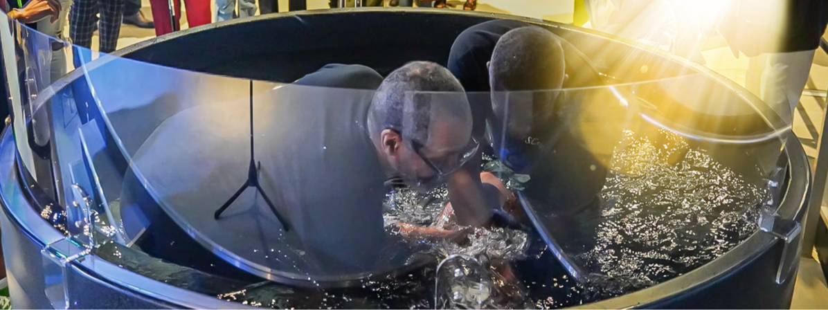 Wide view of the baptism pool during ministry