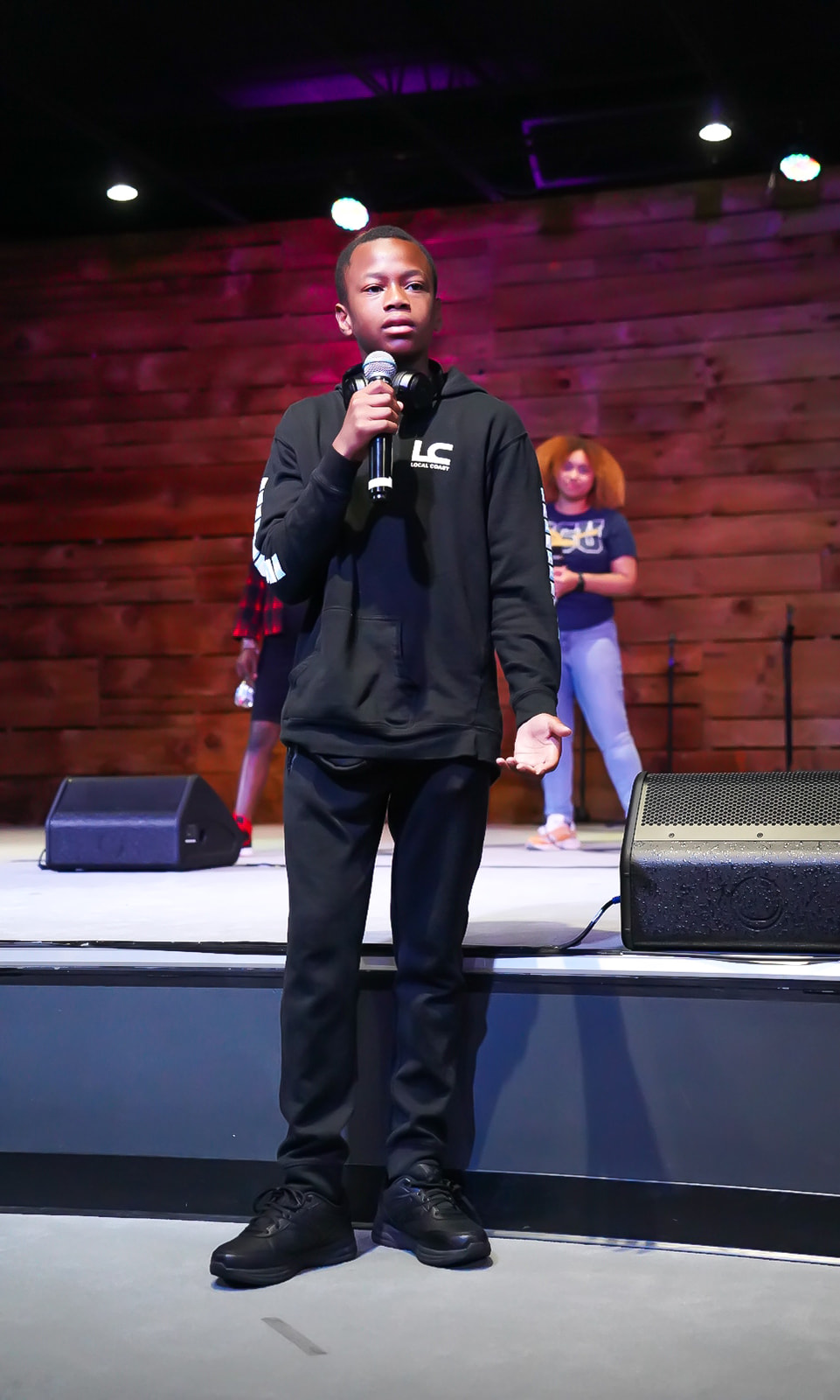 Young man sharing on stage