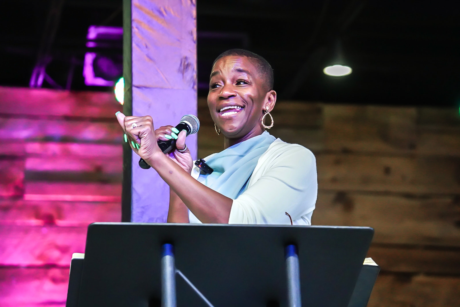 Worship leader smiling on stage