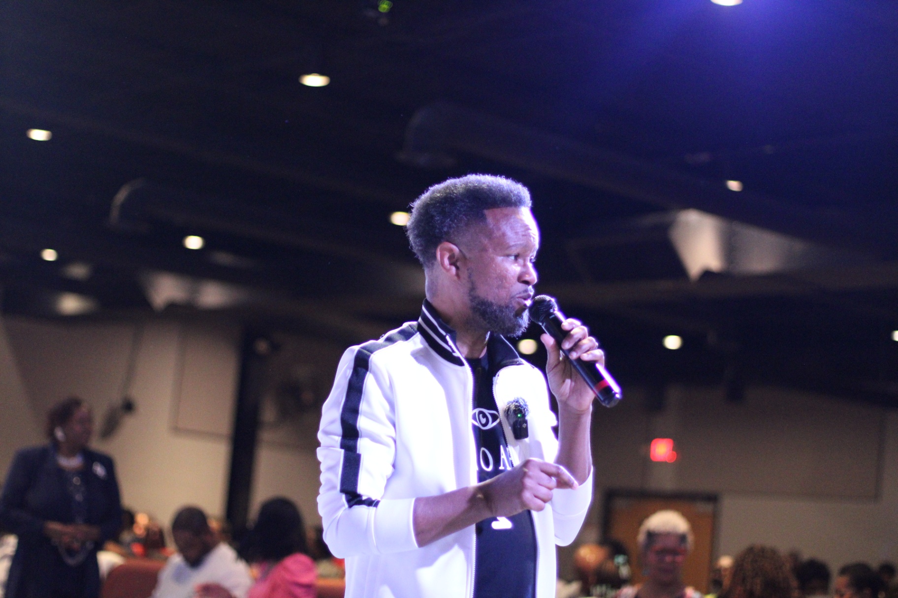 Apostle Craig ministering to the room