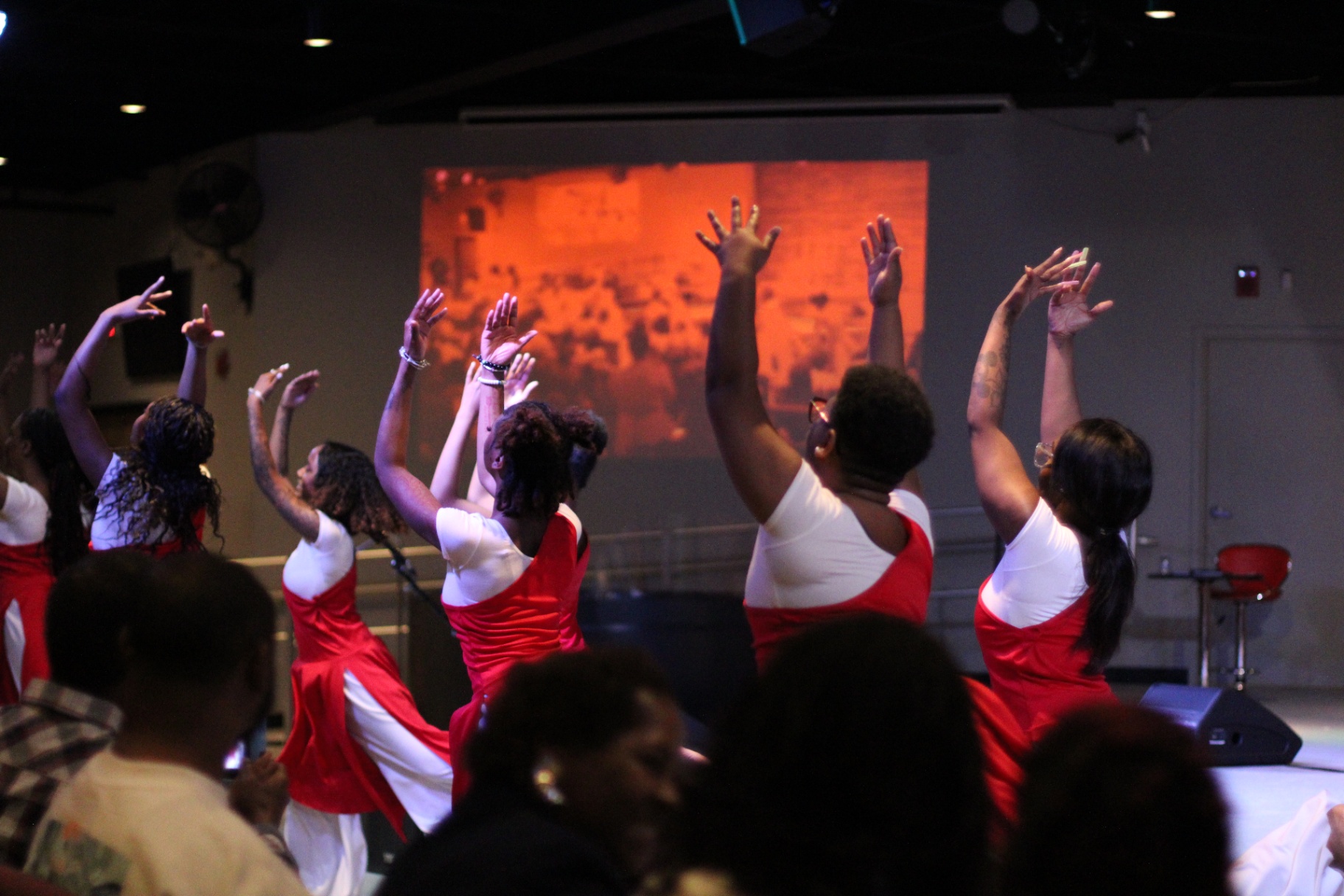 Dancers with hands lifted in worship