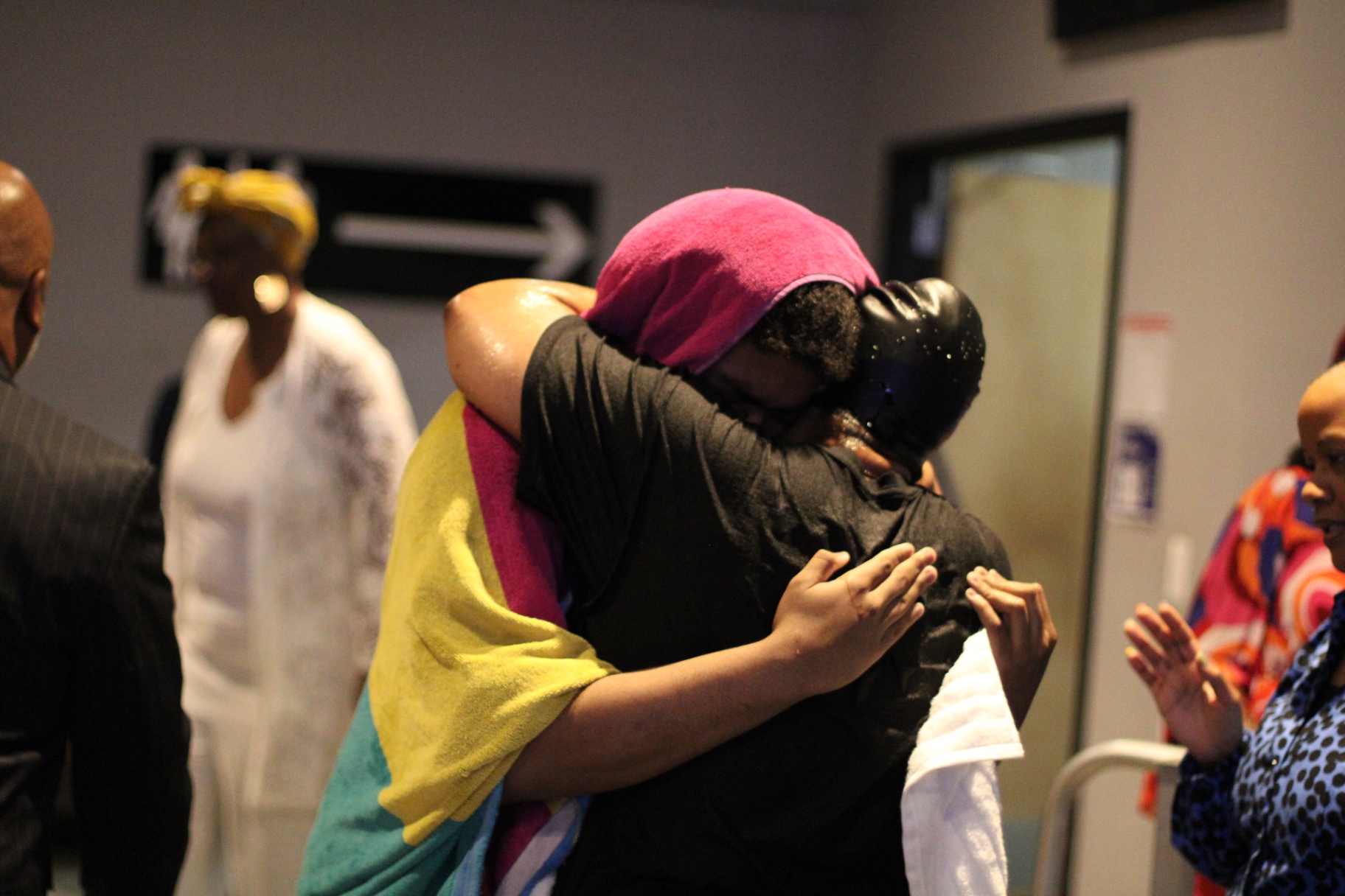 A family embrace after the waters