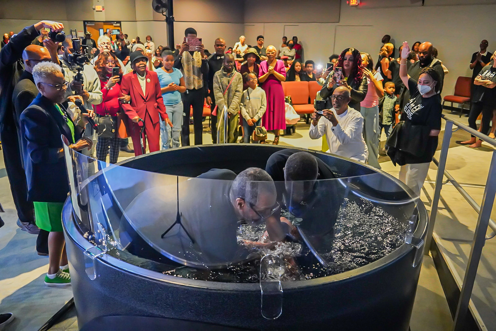 Congregation gathered around the baptism pool