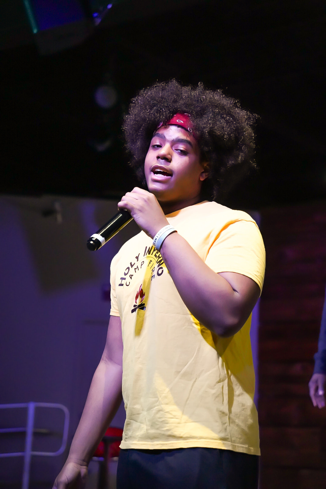 Youth speaking in a Holy Inferno camp tee